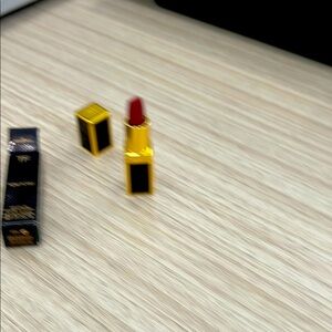 Gold and Black Lipstick with Red Shade